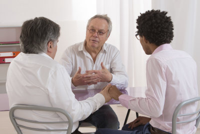 two business partners talking with financial advisor